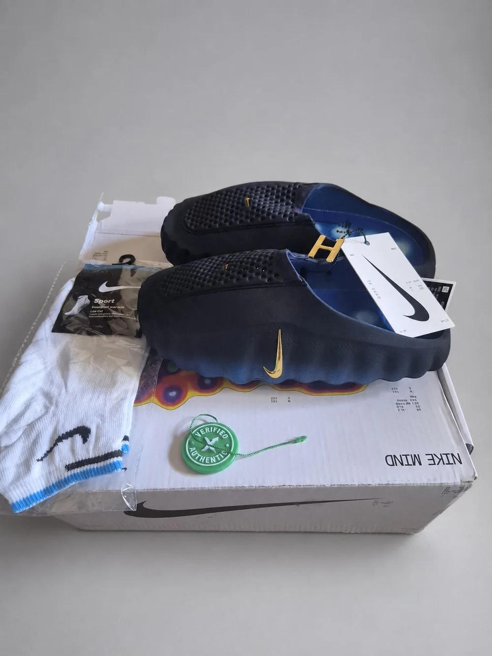 Nike Men’s Navy Foam Slip-On Sandals with Gold Swoosh